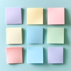 Pastel Colored Sticky Notes Arranged on Blue Background