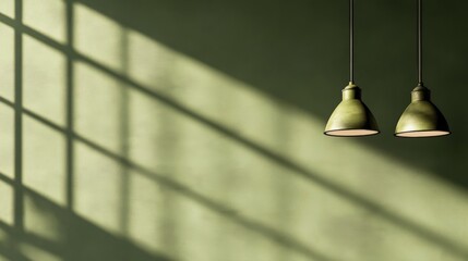 Obraz premium Elegant green wall with hanging lamps casting shadows, creating a serene atmosphere in a room
