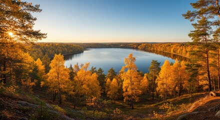 Fototapeta premium Serene Autumn Landscape with Golden Trees Surrounding a Calm Lake at Sunset