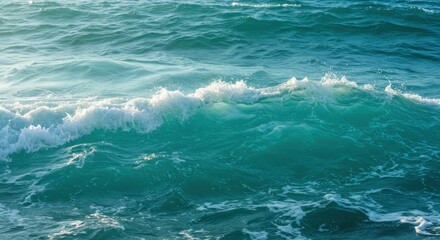 Serene ocean waves gently rolling under a clear blue sky at sunset, evoking tranquility