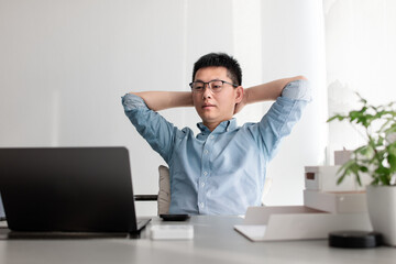 asian businessman working on laptop in office