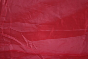 Vibrant Red Fabric Texture: Close-up, high-resolution photograph of a smooth, textured red fabric, perfect for showcasing a luxurious and bold look.