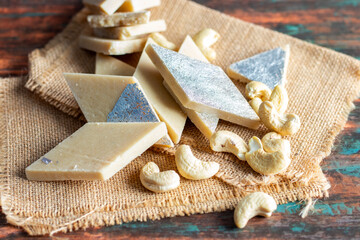 Kaju Katli is a rich, smooth Indian sweet made from cashew nuts, sugar, and ghee, delicately flavoured with cardamom and often adorned with silver leaf.