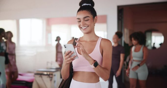 Gym, woman and happy with mobile for fitness, virtual tutorial and communication on social media. Health club, female person and laughing with smartphone for application, exercise meme and walking