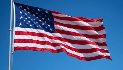 Obraz premium American Flag Waving in the Wind with a Clear Blue Sky on Independence Day