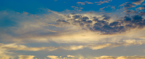 Fototapeta premium Cloudy sky and bright sunrise over the horizon.