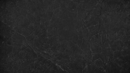 Obraz premium image presenting a close-up view of a slab or tile of black marble, showcasing its natural veining patterns and smooth, dark black polished surface, suitable for use as a background design projects.
