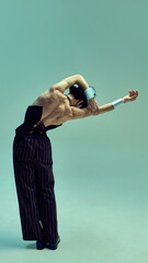 Expressive dancer bending arms in sculptural motion, emphasizing fluidity and structure in...