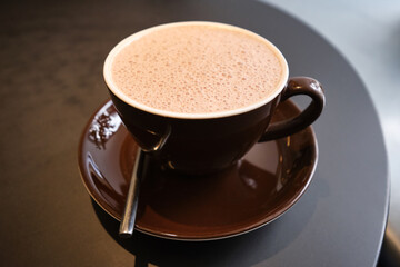 Cup of hot cacao, hot chocolate. Shallow depth of field