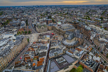 Obraz premium Stunning aerial view of Koninklijk Paleis - The Royal Palace in Amsterdam showcasing its iconic architecture, the iconic Town squareand vibrant cityscape.