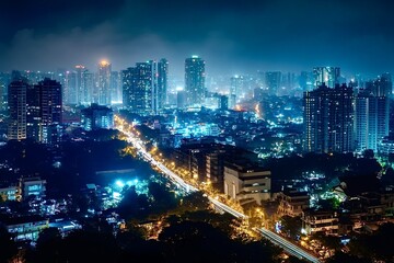 Fototapeta premium Busy highway cutting through illuminated cityscape at night