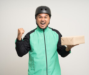 Young asian rider wearing green jacket uniform and bike helmet various action holding paper parcel box delivery to customer. Delivery man service worker Courier and shipping parcel cardboard service.