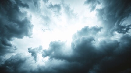 Fototapeta premium Dramatic stormy sky with dark clouds and bright light for atmospheric and creative design