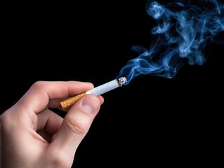 Close-up of a hand holding a lit cigarette with rising smoke against a solid black background