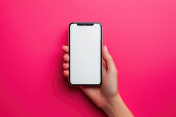 A woman's hand holding a smartphone with a blank white screen against a bold pink background. Ideal for app design, digital marketing, and product mockups