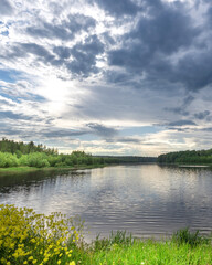 Calm lake with a cloudy sky in the background
