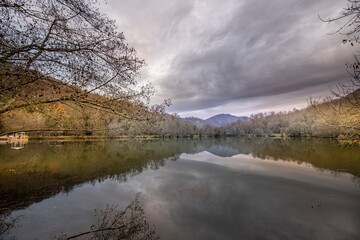 Lake with a cloudy sky in the background