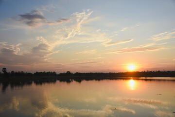 Orange sky with clouds at sunset