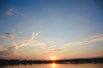 Orange sky with clouds at sunset