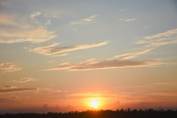 Orange sky with clouds at sunset