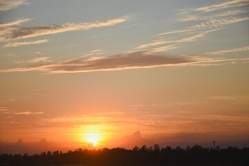 Orange sky with clouds at sunset