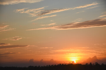 Orange sky with clouds at sunset