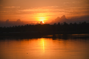Orange sky with clouds at sunset