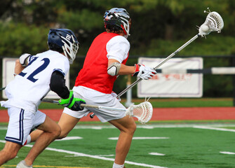 Exciting Moments During a Youth Lacrosse Game on a Sunny Afternoon at the Local Sports Field