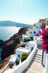 Obraz premium Sun-kissed Whitewashed Houses Cascading Down a Cliffside, Overlooking a Serene Azure Sea, Adorned with Vibrant Pink Blossoms