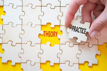 Theory or Practice symbol. Concept word Theory or Practice on wooden puzzle. Businessman hand....