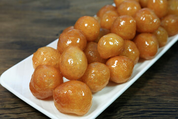 Lokma Tatlısı Traditional Turkish dessert Lokma on rustic wood