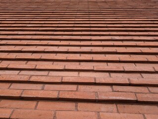 Pattern of a stepped red brick wall