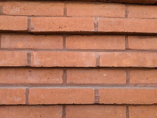 Pattern of a stepped red brick wall