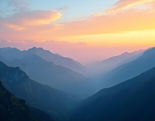 Soft golden light of sunrise illuminating textured slopes and mountain mist.