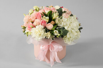 Bouquet of beautiful flowers on grey background