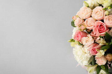 Bouquet of beautiful flowers on grey background, top view. Space for text