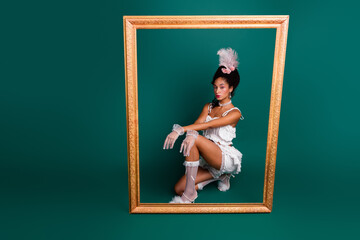 A young woman in elegant historical costume is framed against a vibrant green backdrop, blending...