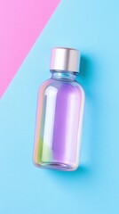Overhead view of a small, clear glass bottle with a silver cap, filled with a light purple liquid. The bottle is on a pastel pink and blue background. 