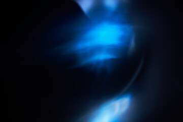 Ethereal Blue Light Streaks on Dark Background