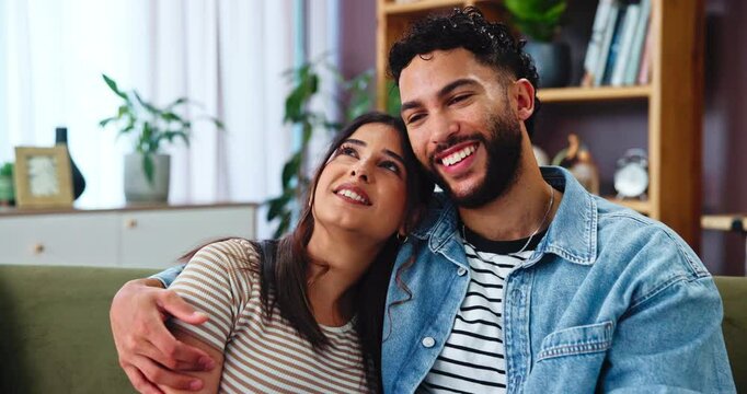 Hug, couple and laugh in living room with smile, bonding and gossip on sofa in apartment. Embrace, man and woman with communication in lounge, relationship and relax in home with happiness together
