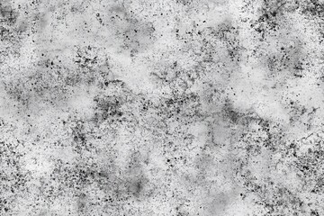 Obraz premium Seamless concrete bunker textured background with a grunge, distressed appearance, featuring black and gray speckles and smudges on a white surface.