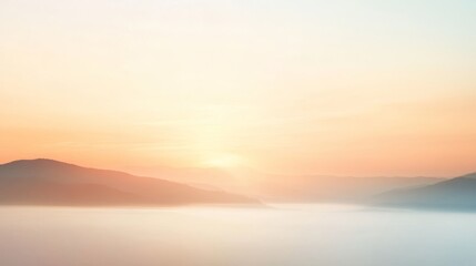 Fototapeta premium Gentle sunrise illuminates the peaks of mountains and the valley below