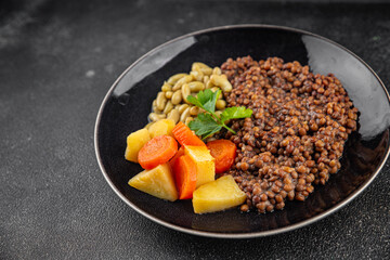 Vegetarian main course vegetables lentils, beans, potatoes, carrots tasty fresh delicious gourmet food background on the table rustic food top view copy space keto and paleo diet vegetarian and vegan 