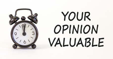 Your opinion valuable symbol. Concept words Your opinion valuable on beautiful white paper. Beautiful white background. Black alarm clock. Business your opinion valuable concept. Copy space.