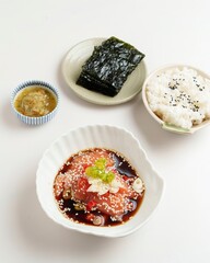 Fresh Sushi Bowl with Salmon, Rice, Seaweed, and Soy Sauce Garnish