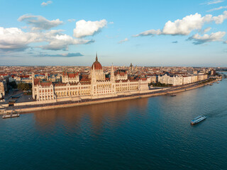 Aerial view Residence of Hungarian Parliament, Budapest. National building symbol view from opposite bank of Danube River backdrop of sunset on sunny day in summer. Travel destination. Tourism