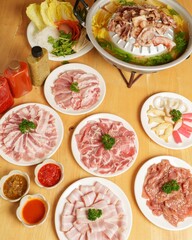 Fresh Assortment of Sliced Meats and Vegetables for Cooking