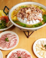 Delicious Asian Hot Pot with Fresh Ingredients and Variety of Meats