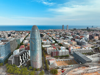 Facade tall metal tower residential buildings city blocks boulevards with green trees in summer on sunny day sunrise on lens flares. Go Everywhere 