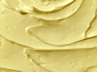 Close-up of lemon cream background, light yellow cream texture for food design and background, mayonnaise texture